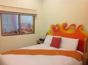 Postel nebo postele na pokoji v ubytování Kenting Sun & Sea B&B