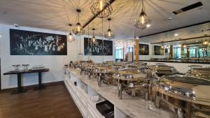 a restaurant with a counter with drums on it at d'primahotel Lagoi Bintan in Lagoi