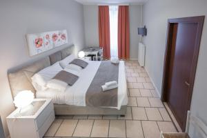 A bed or beds in a room at Affittacamere Berzi