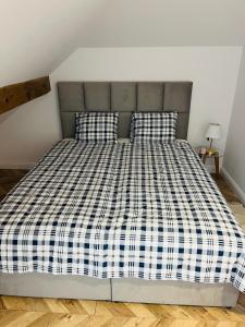 Postel nebo postele na pokoji v ubytování Apartament MM MIEJSCE PARKINGOWE