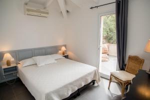 Posteľ alebo postele v izbe v ubytovaní Les Terrasses de Scalegiu