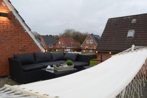 Balkón nebo terasa v ubytování Ferienhaus Kiebitznüst in Emden