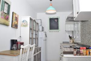 Kuchyň nebo kuchyňský kout v ubytování Hermoso Apartamento Vintage