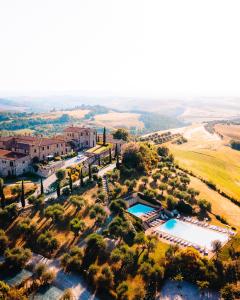 an aerial view of a villa with a swimming pool at Relax Palazzo Monaci in Asciano
