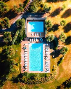 an overhead view of a swimming pool in a park at Relax Palazzo Monaci in Asciano