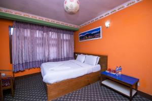 Postel nebo postele na pokoji v ubytování Hotel Pomelo House Inn