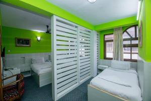 Postel nebo postele na pokoji v ubytování Hotel Pomelo House Inn