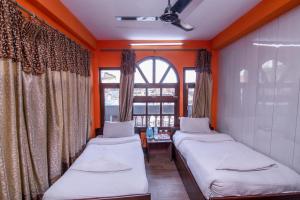 Postel nebo postele na pokoji v ubytování Hotel Pomelo House Inn