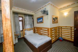 Postel nebo postele na pokoji v ubytování Hotel Pomelo House Inn