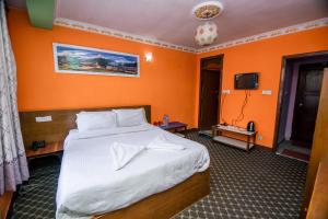 Postel nebo postele na pokoji v ubytování Hotel Pomelo House Inn