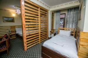 Postel nebo postele na pokoji v ubytování Hotel Pomelo House Inn