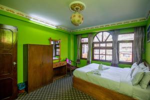 Postel nebo postele na pokoji v ubytování Hotel Pomelo House Inn