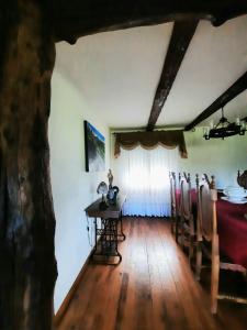 a dining room with a table and chairs in it at Quintinha d´Amélia in Celorico de Basto +14 photos