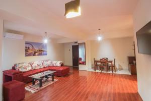a living room with a couch and a table at Hotel INTERNATIONAL Ohrid in Ohrid