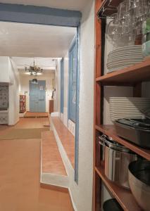a hallway with a door into a kitchen with dishes at Vista Del Drago in Icod de los Vinos