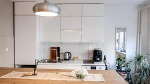 Kuchyň nebo kuchyňský kout v ubytování Cosy apartment