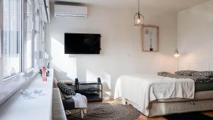 Postel nebo postele na pokoji v ubytování Cosy apartment