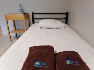 Postel nebo postele na pokoji v ubytování Hostel CENTRUM