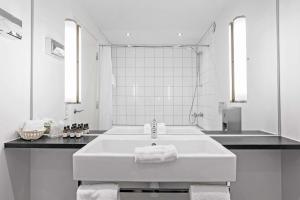 Een badkamer bij Best Western ToRVEhallerne