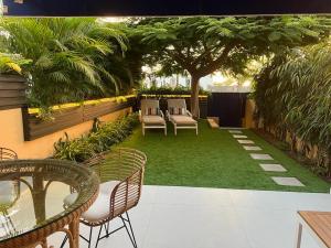 A garden outside Meloneras Garden Suite