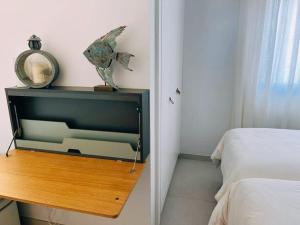 A bed or beds in a room at Meloneras Garden Suite