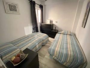 Łóżko lub łóżka w pokoju w obiekcie Rainbow Rentals Marques 7
