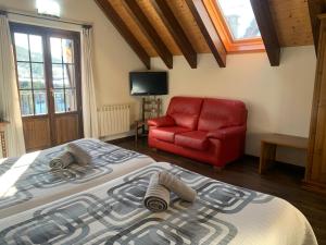 Postel nebo postele na pokoji v ubytování Casa Taconera