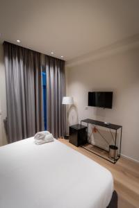 A bed or beds in a room at Pasubio Quattro BB