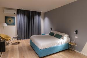A bed or beds in a room at Pasubio Quattro BB