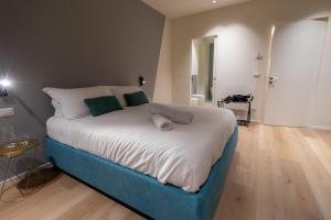 A bed or beds in a room at Pasubio Quattro BB