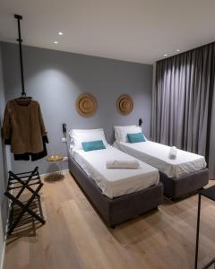 A bed or beds in a room at Pasubio Quattro BB