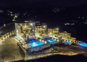 an aerial view of a building at night at Antigoni Villas in Gavrio