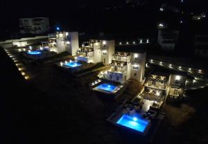 an aerial view of a building at night at Antigoni Villas in Gavrio