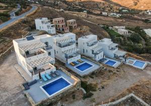 an aerial view of a large white house at Antigoni Villas in Gavrio