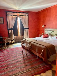 Giường trong phòng chung tại Hotel Casa Henrietta