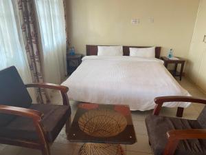 Postel nebo postele na pokoji v ubytování Ranges View Lodge Staycation
