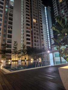 a group of people standing in front of a tall building at SCANDI HOMESTAY IPOH muslem in Ipoh