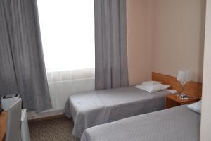 Postel nebo postele na pokoji v ubytování Hotel Yes