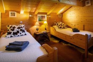 Łóżko lub łóżka w pokoju w obiekcie Lodge le Chevreuil - OVO Network