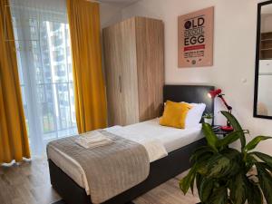 Postel nebo postele na pokoji v ubytování Arche Residence Łódź + 47 fotografií