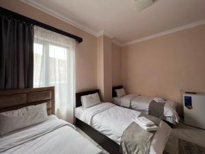 Voodi või voodid majutusasutuse RP HOTEL (NEW) toas
