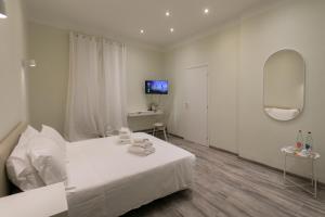 Postel nebo postele na pokoji v ubytování Hotel L'Aretino