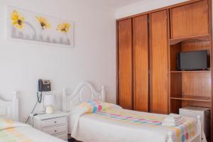 Cama o camas de una habitación en Residencial Princesa do Ave