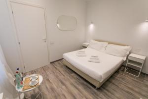 Postel nebo postele na pokoji v ubytování Hotel L'Aretino