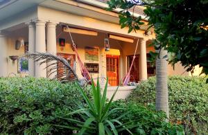 a house with a plant in front of it at Frieden-Hof Guest Accommodation in Penhill