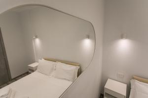 Postel nebo postele na pokoji v ubytování Hotel L'Aretino