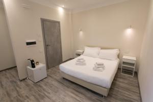 Postel nebo postele na pokoji v ubytování Hotel L'Aretino