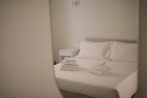 Postel nebo postele na pokoji v ubytování Hotel L'Aretino