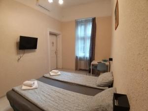 Posteľ alebo postele v izbe v ubytovaní Melisa Apartment