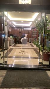 a lobby of a building with a glass wall at دانة الشرق للشقق المخدومة in Al Khobar